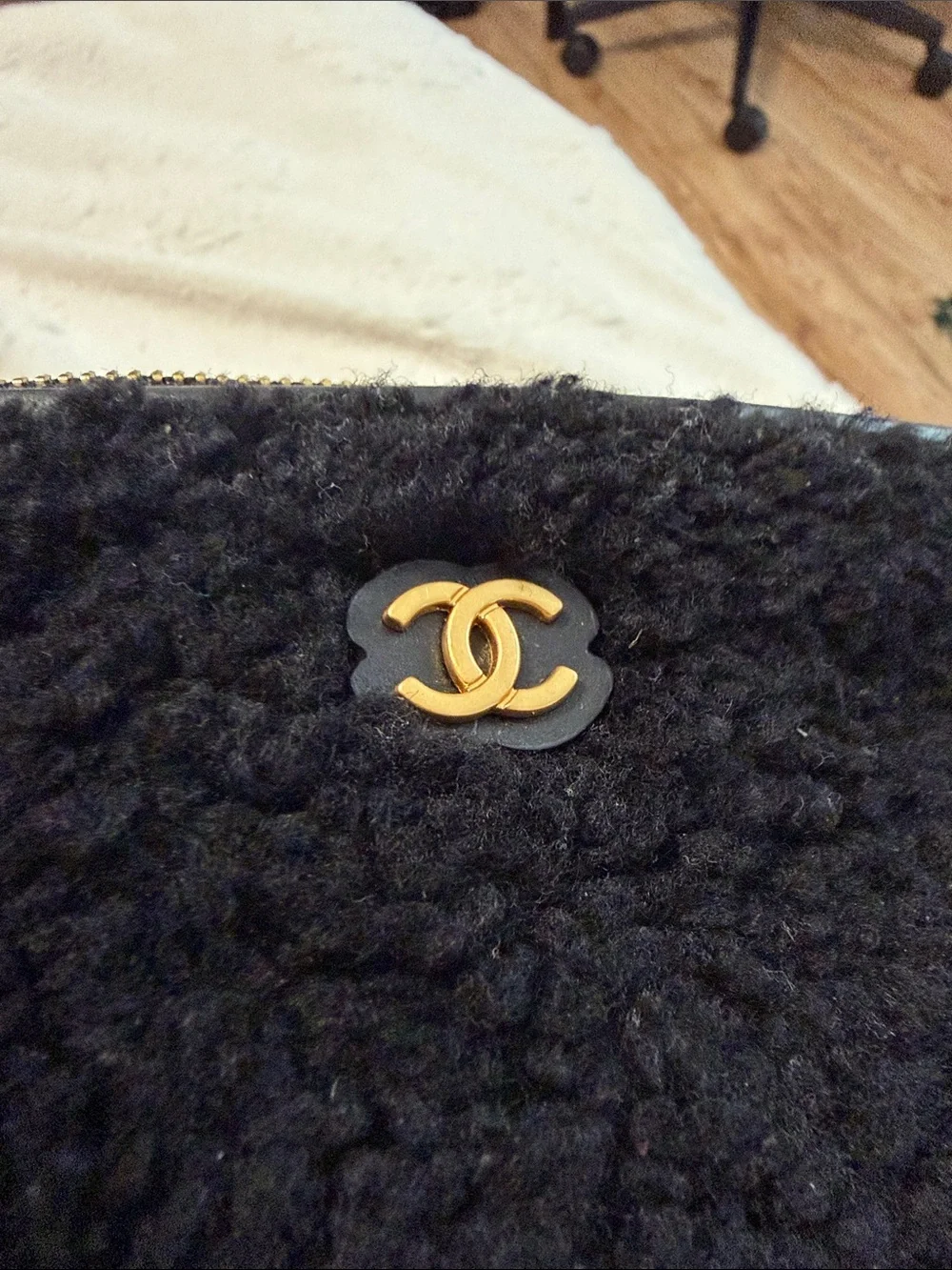 CHANEL Black Shearling Phone Case with Gold CC Emblem